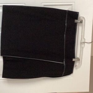 Black mini skirt with faux leather trim